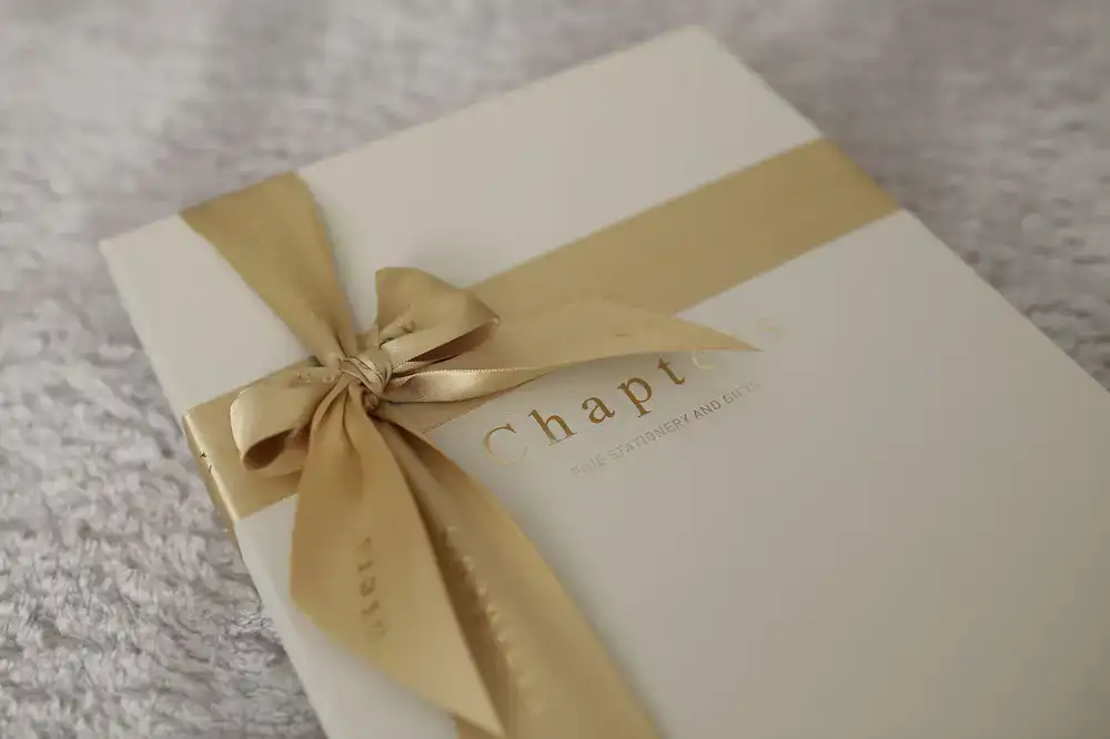 A large bespoke presentation portfolio with cloth hinges and a ribbon tie
