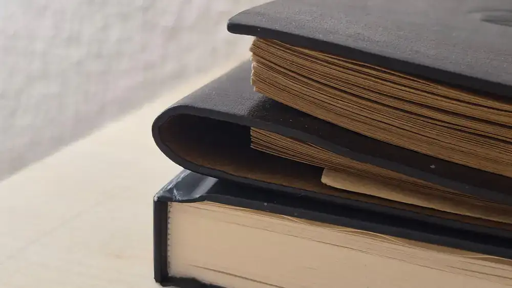 Bookbinder working meticulously on a spine